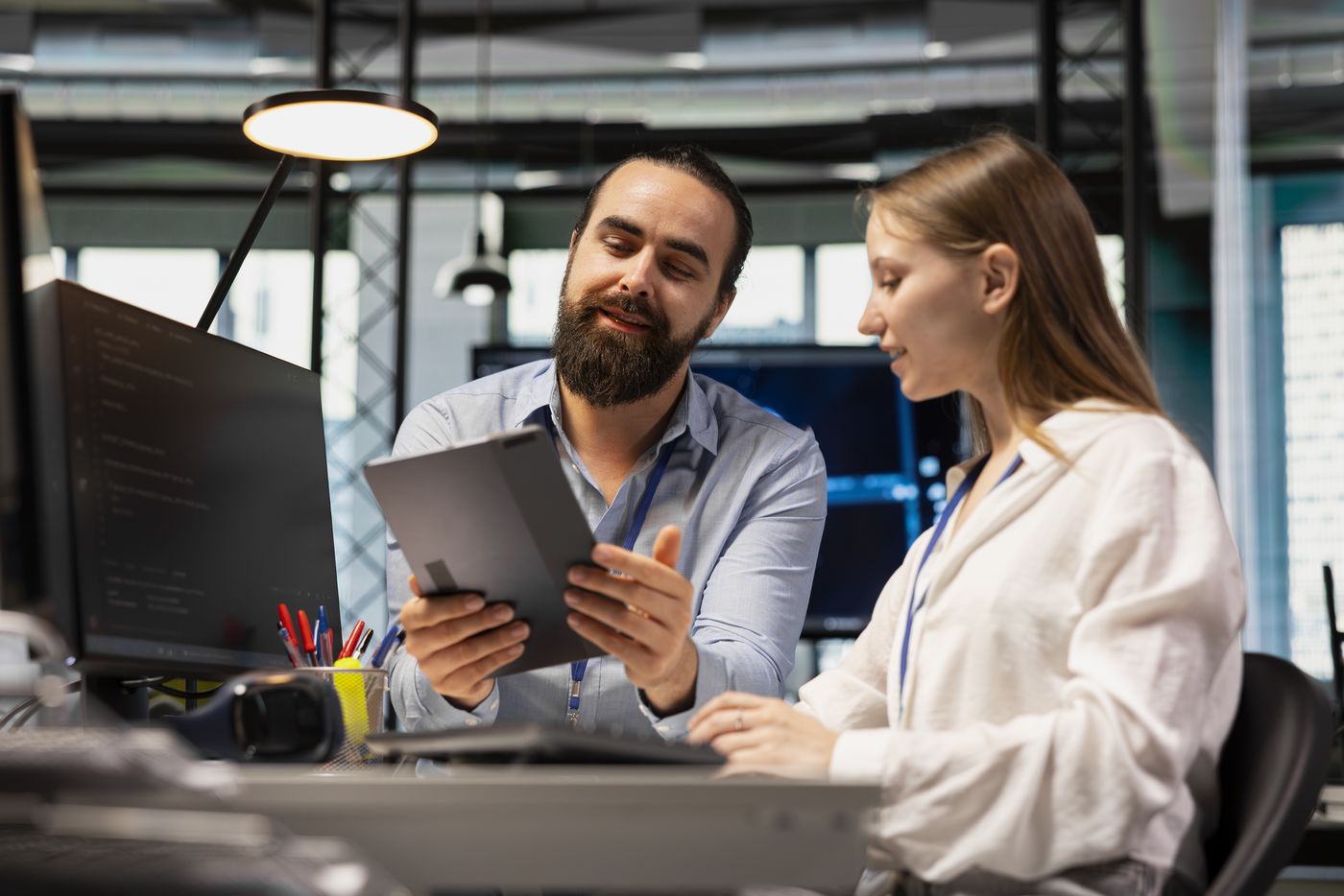 A DTS technician guiding a team member through a fix